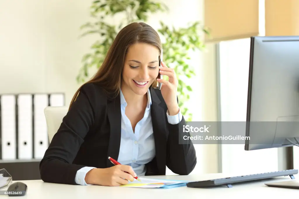 Business woman on phone speaking with client