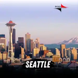 The space needle of Seattle penetrates a lilac sky. Sky scrappers cascade across the city of Seatle until Mount Rainier breaks the view. The Bond Investigations logo is top right and bottom cented text reads Seattle.